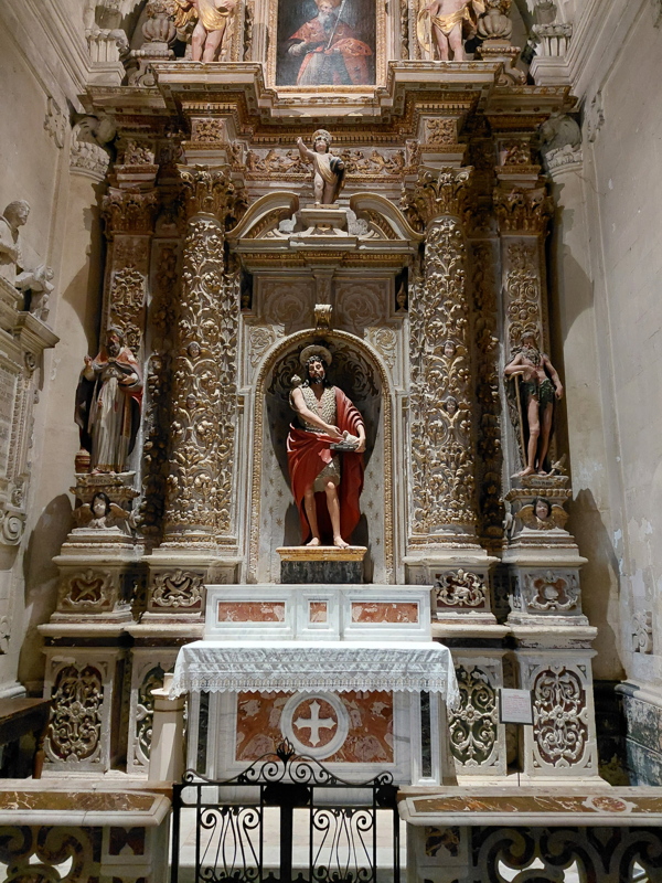 Lateral baroque altar inside the Lecce Cathedral, also known as the Metropolitan Cathedral of Santa Maria Assunta